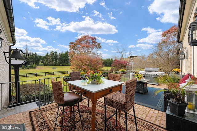 view of patio / terrace with outdoor dining space and grilling area