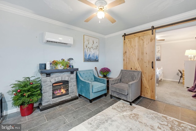 sitting room with a barn door, ceiling fan, crown molding, a fireplace, and a wall mounted AC