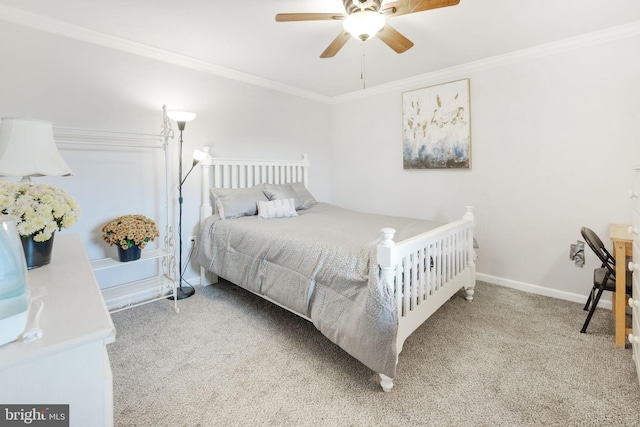 bedroom with baseboards, ceiling fan, carpet, and crown molding