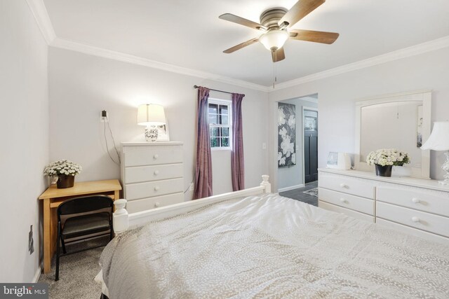 bedroom featuring baseboards, carpet floors, a ceiling fan, and crown molding