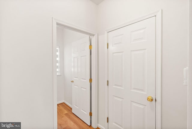 corridor featuring light wood-style floors