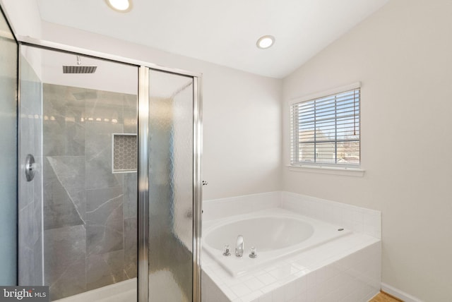 bathroom featuring lofted ceiling, a stall shower, a bath, and recessed lighting