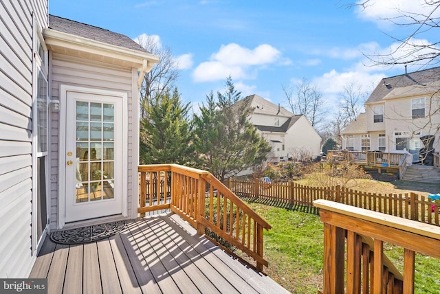 wooden terrace with fence and a residential view