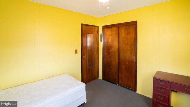 carpeted bedroom with a closet