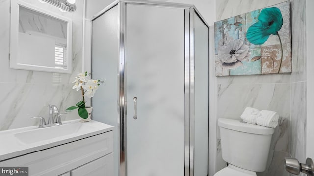 bathroom featuring a stall shower, toilet, tile walls, and vanity