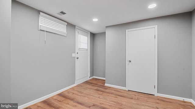 interior space featuring light wood finished floors, visible vents, recessed lighting, and baseboards