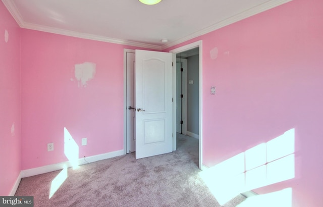 unfurnished bedroom featuring light carpet and ornamental molding