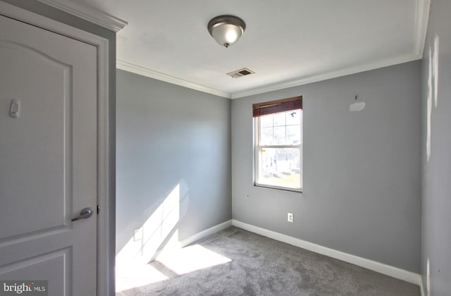 carpeted empty room with ornamental molding