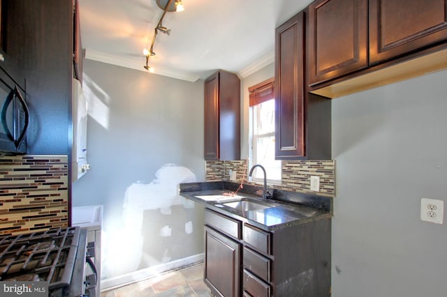 kitchen with sink, decorative backsplash, and ornamental molding