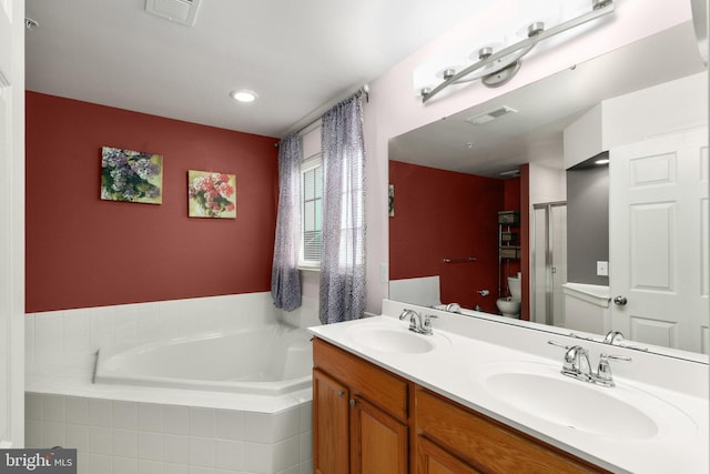 full bathroom with vanity, toilet, and shower with separate bathtub