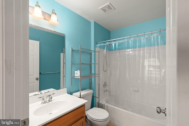 full bathroom with vanity, shower / bath combination with curtain, and toilet