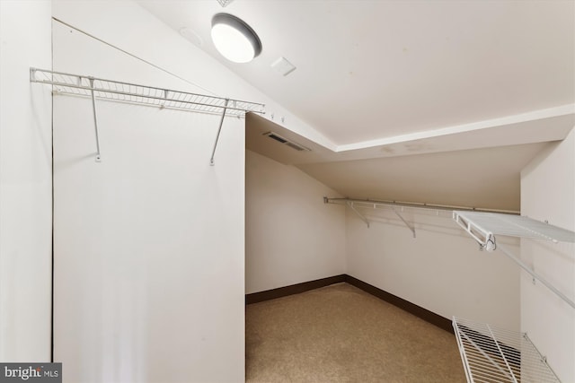 walk in closet with vaulted ceiling and visible vents