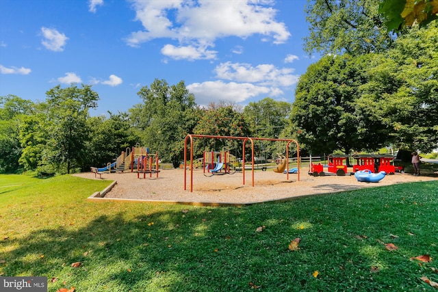 community jungle gym with a lawn