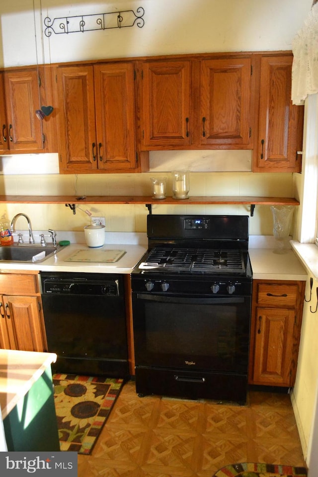 kitchen featuring sink and black appliances