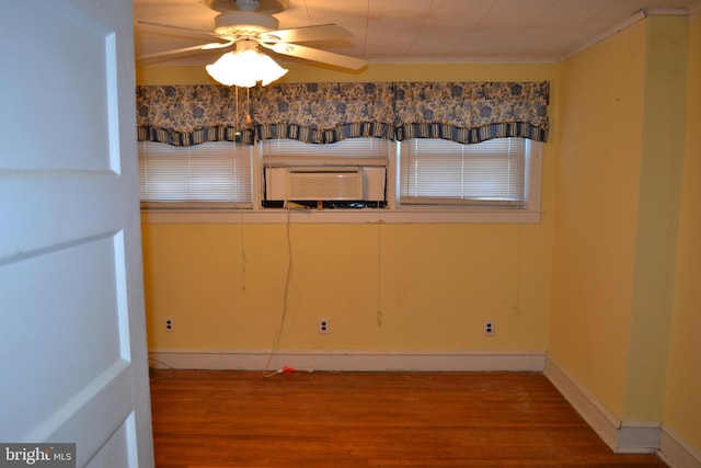 empty room featuring ornamental molding, hardwood / wood-style floors, ceiling fan, and cooling unit