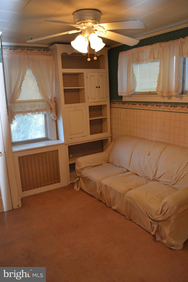 interior space featuring radiator heating unit and carpet flooring