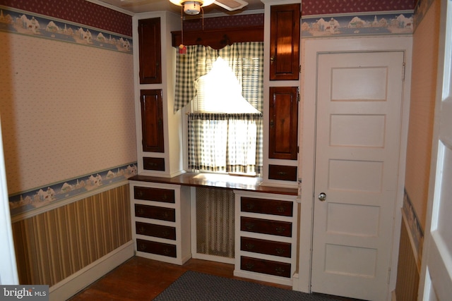 interior space with dark hardwood / wood-style floors and ceiling fan