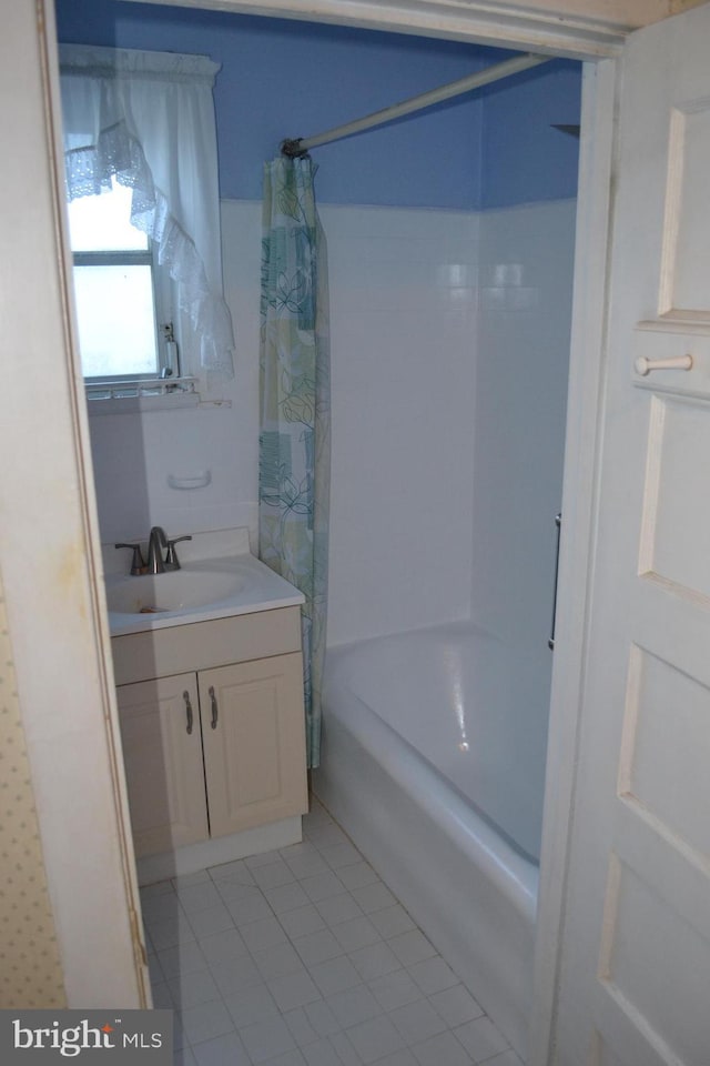 bathroom with vanity, tile patterned flooring, and shower / bath combo