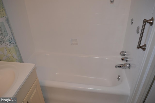 bathroom featuring vanity and washtub / shower combination