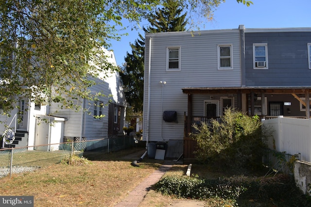 back of house featuring a yard