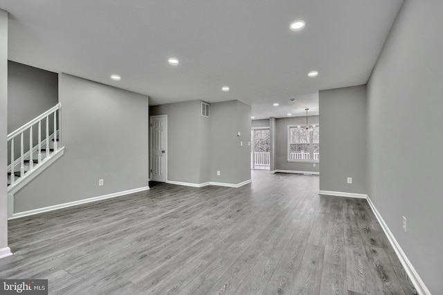 unfurnished living room featuring wood-type flooring