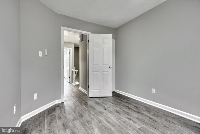 unfurnished bedroom with light wood-type flooring