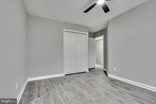 unfurnished bedroom featuring a closet, ceiling fan, and light hardwood / wood-style flooring