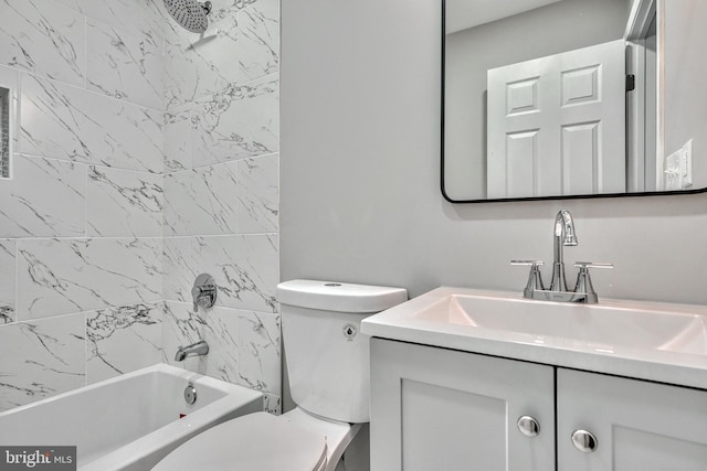 full bathroom with vanity, tiled shower / bath combo, and toilet