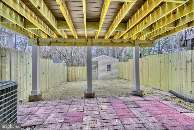 view of patio featuring a storage shed and central air condition unit