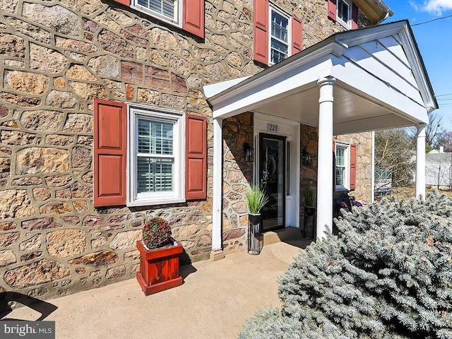 view of exterior entry with stone siding