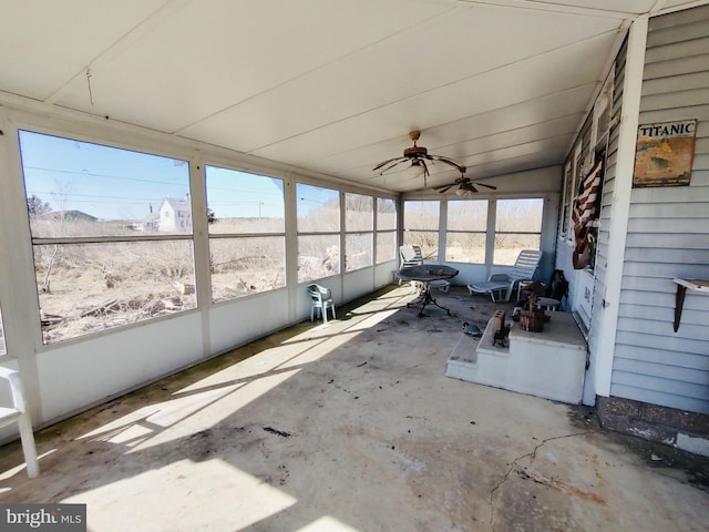 unfurnished sunroom with lofted ceiling