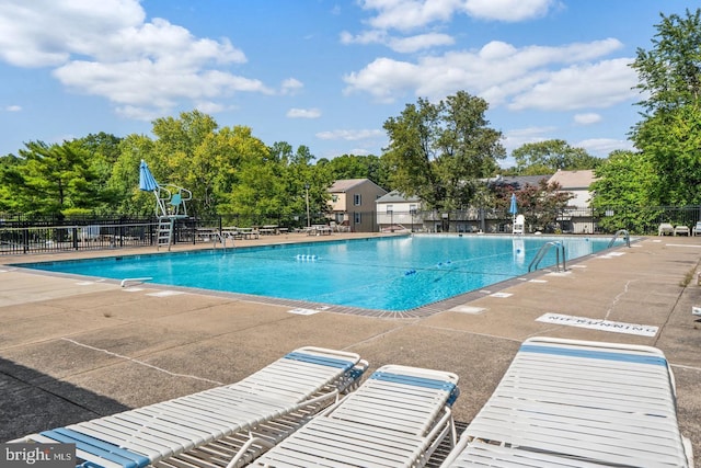 view of swimming pool with a patio area