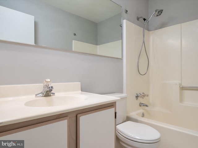 bathroom with shower / bath combination, vanity, and toilet