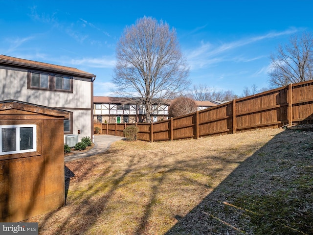 view of yard featuring a fenced backyard and cooling unit