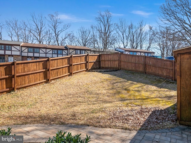 view of yard with a fenced backyard