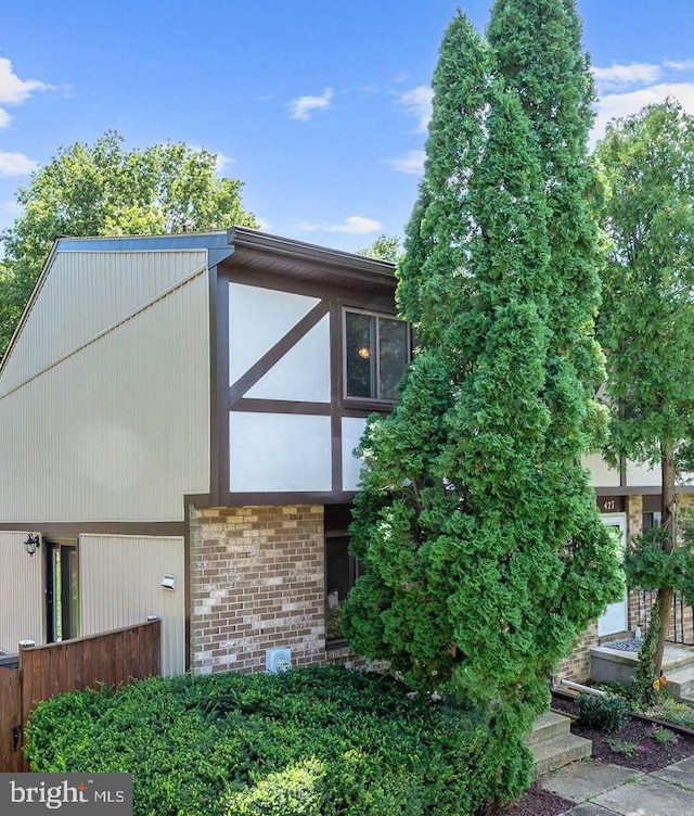 exterior space featuring brick siding