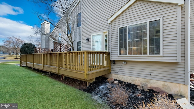 wooden terrace with a yard