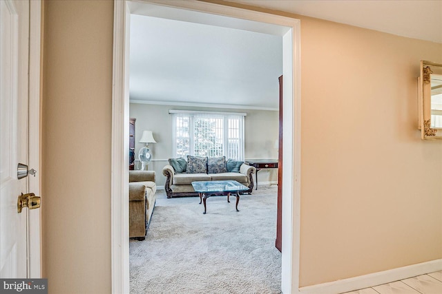 living room featuring crown molding and light colored carpet