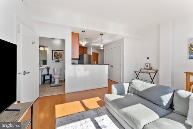 living room with light hardwood / wood-style floors