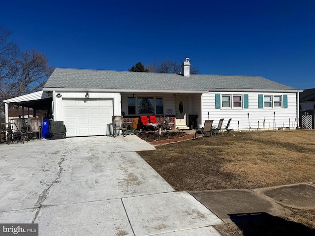 single story home featuring a garage, a porch, and a front yard