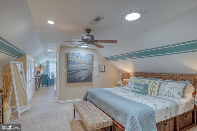 bedroom featuring light carpet, vaulted ceiling, and ceiling fan