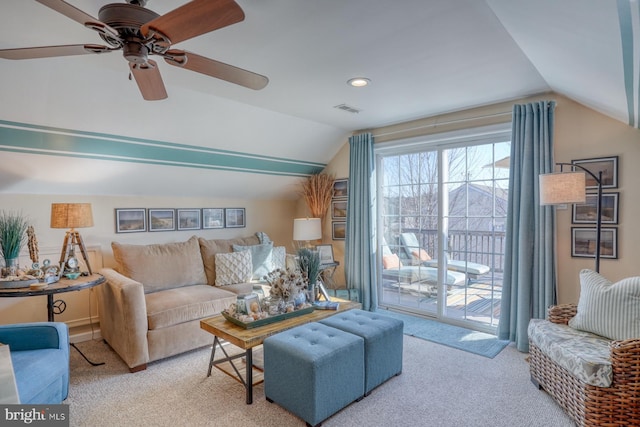 carpeted living room featuring lofted ceiling