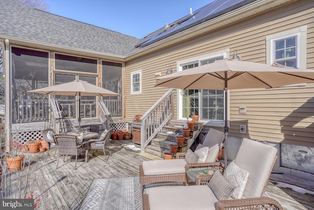 wooden terrace with a sunroom