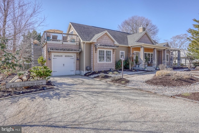 view of front of property featuring a garage and covered porch