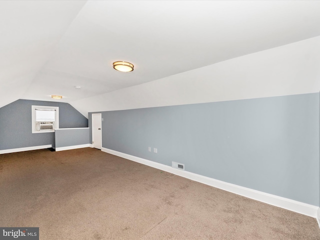 bonus room featuring cooling unit, lofted ceiling, and carpet flooring