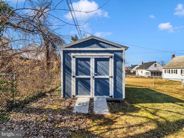 view of outbuilding with a lawn