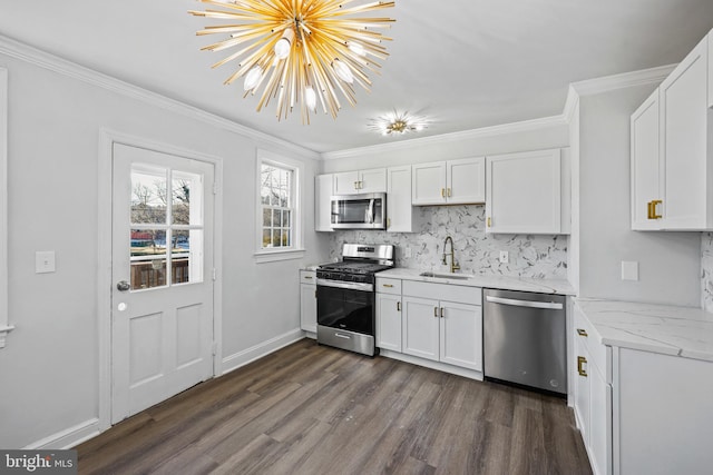 kitchen with stainless steel appliances, sink, dark wood-type flooring, and white cabinets