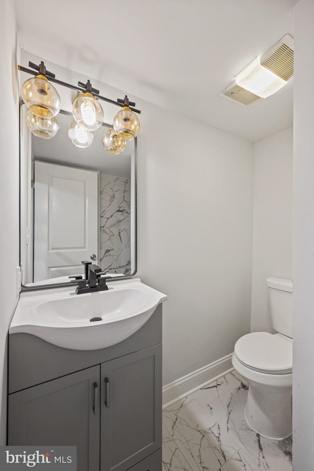 bathroom with vanity and toilet