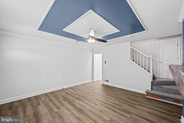 interior space with hardwood / wood-style flooring, crown molding, and ceiling fan