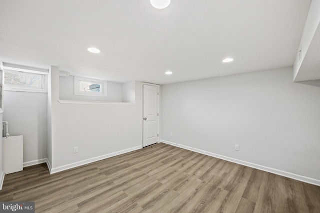 basement featuring hardwood / wood-style floors